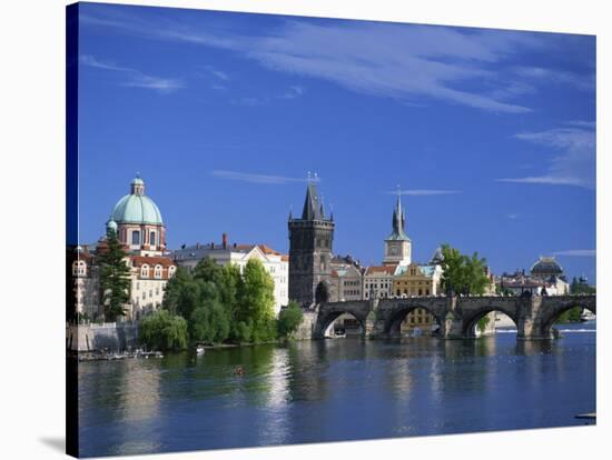 Charles Bridge over the Vltava River and City Skyline of Prague, Czech Republic, Europe-Nigel Francis-Stretched Canvas