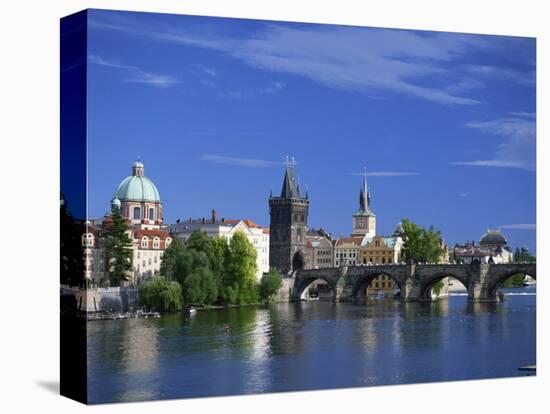 Charles Bridge over the Vltava River and City Skyline of Prague, Czech Republic, Europe-Nigel Francis-Stretched Canvas