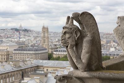 Europe, France, Paris. a Gargoyle on the Notre Dame Cathedral