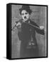 Charlie Chaplin as a Street Musician in The Vagabond-null-Framed Stretched Canvas