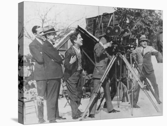 Charlie Chaplin Laughing During Shooting of Film-null-Stretched Canvas