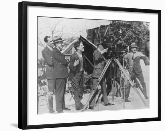 Charlie Chaplin Laughing During Shooting of Film-null-Framed Premium Photographic Print