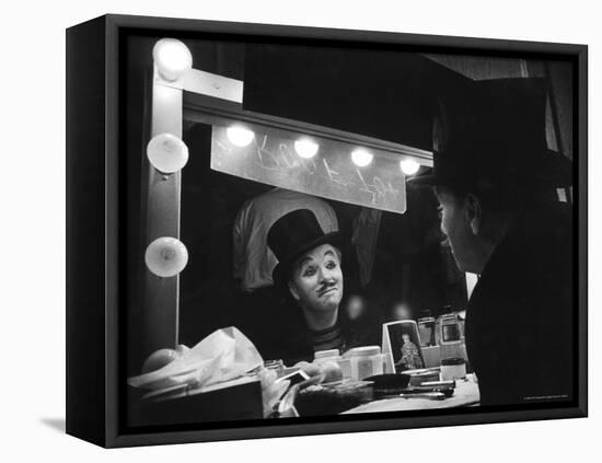 Charlie Chaplin Looking Into Mirror, Putting on Makeup for Role as the Animal Trainer-W^ Eugene Smith-Framed Stretched Canvas