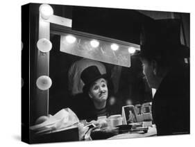 Charlie Chaplin Looking Into Mirror, Putting on Makeup for Role as the Animal Trainer-W^ Eugene Smith-Stretched Canvas