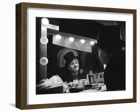 Charlie Chaplin Looking Into Mirror, Putting on Makeup for Role as the Animal Trainer-W^ Eugene Smith-Framed Premium Photographic Print