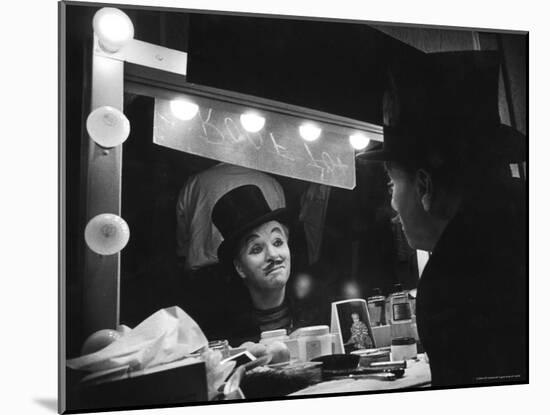 Charlie Chaplin Looking Into Mirror, Putting on Makeup for Role as the Animal Trainer-W^ Eugene Smith-Mounted Premium Photographic Print