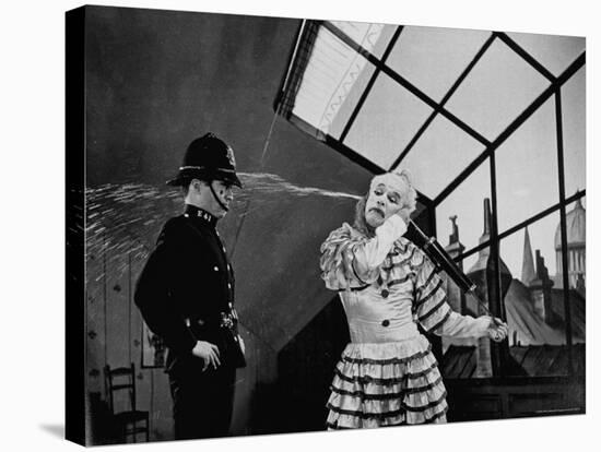 Charlie Chaplin Squirting Water Into Face of Policeman, Scene from Limelight-W^ Eugene Smith-Stretched Canvas
