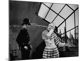 Charlie Chaplin Squirting Water Into Face of Policeman, Scene from Limelight-W^ Eugene Smith-Mounted Premium Photographic Print