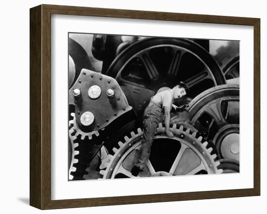 Charlie Chaplin. "The Masses" 1936, "Modern Times" Directed by Charles Chaplin-null-Framed Photographic Print