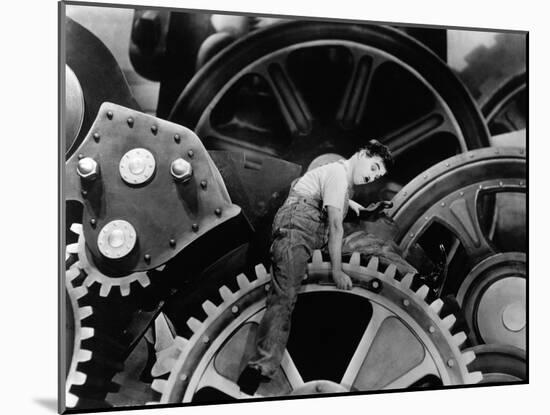 Charlie Chaplin. "The Masses" 1936, "Modern Times" Directed by Charles Chaplin-null-Mounted Photographic Print