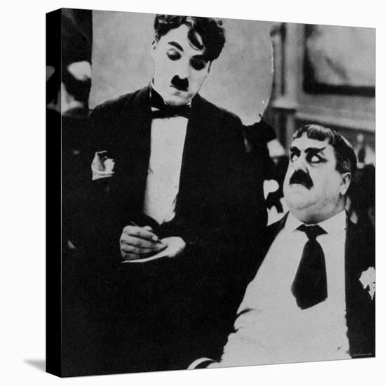 Charlie Chaplin with Eric Campbell in The Rink-null-Stretched Canvas