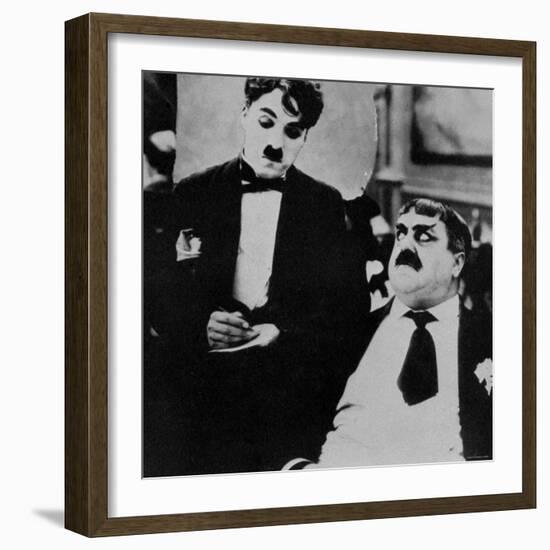 Charlie Chaplin with Eric Campbell in The Rink-null-Framed Premium Photographic Print