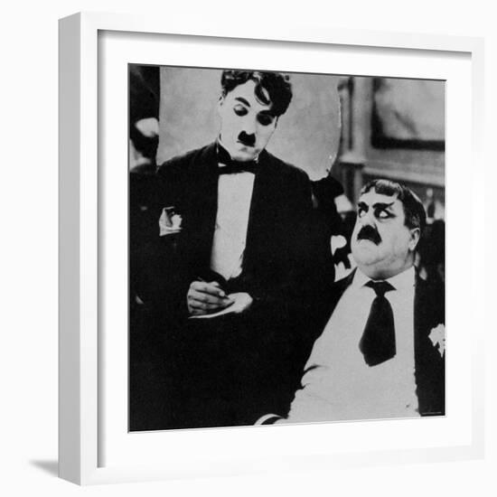 Charlie Chaplin with Eric Campbell in The Rink-null-Framed Premium Photographic Print