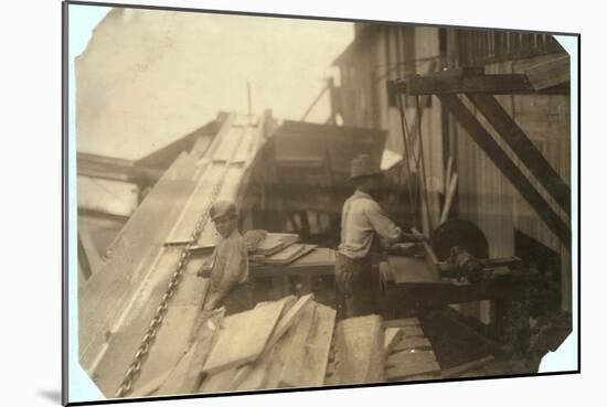 Charlie Mcbride Aged 12 Takes Wood from a Chute for 10 Hours at Miller and Vidor Lumber Company-Lewis Wickes Hine-Mounted Photographic Print