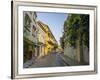 Charming residential street in historic Cartagena, Colombia.-Jerry Ginsberg-Framed Photographic Print