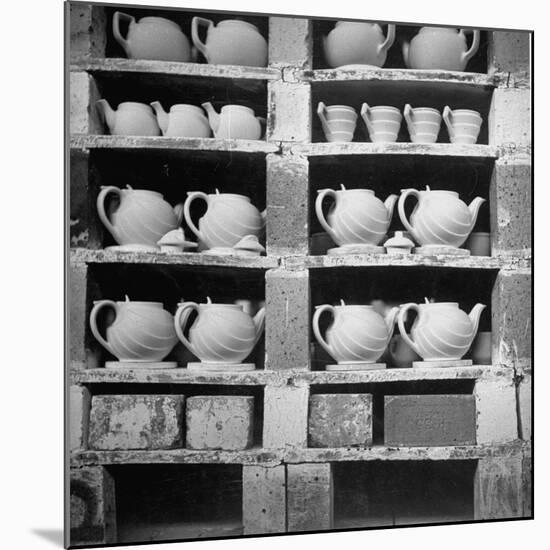 Cheap Chinaware Saucers, Cups, Teapots, Etc Standing on Racks in Pottery of the Hall China Co-Walker Evans-Mounted Photographic Print