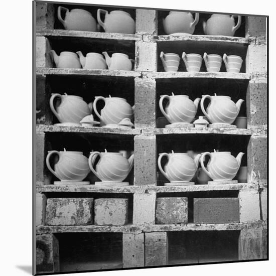 Cheap Chinaware Saucers, Cups, Teapots, Etc Standing on Racks in Pottery of the Hall China Co-Walker Evans-Mounted Photographic Print