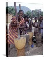 Cheerful Young Girls Pound Corn Outside Families' Homes Near Monkey Bay, South End of Lake Malawi-Nigel Pavitt-Stretched Canvas