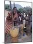 Cheerful Young Girls Pound Corn Outside Families' Homes Near Monkey Bay, South End of Lake Malawi-Nigel Pavitt-Mounted Photographic Print