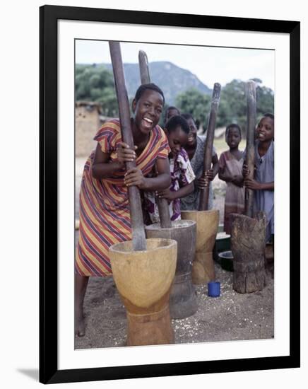 Cheerful Young Girls Pound Corn Outside Families' Homes Near Monkey Bay, South End of Lake Malawi-Nigel Pavitt-Framed Photographic Print