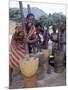 Cheerful Young Girls Pound Corn Outside Families' Homes Near Monkey Bay, South End of Lake Malawi-Nigel Pavitt-Mounted Photographic Print