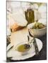 Cheese, Olives and Olive Oil on Table Out of Doors-null-Mounted Photographic Print