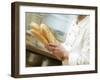 Chef Hurrying Through Kitchen with Baguettes-null-Framed Photographic Print