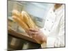 Chef Hurrying Through Kitchen with Baguettes-null-Mounted Photographic Print