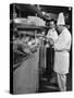 Chefs Working in a Restaurant Kitchen at Radio City-null-Stretched Canvas