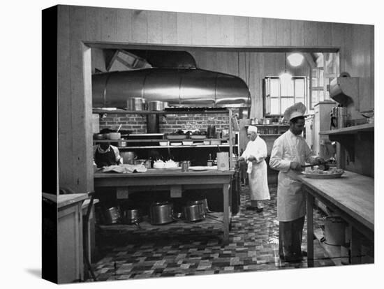 Chefs Working in the Kitchen at Gables-Peter Stackpole-Stretched Canvas