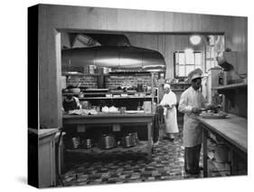 Chefs Working in the Kitchen at Gables-Peter Stackpole-Stretched Canvas