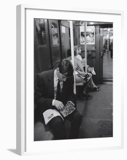 Chess Champion Bobby Fischer Working on His Moves During a Subway Ride-Carl Mydans-Framed Premium Photographic Print