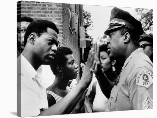 Chicago African American Policeman Tries to Calm a Crowd-null-Stretched Canvas