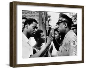 Chicago African American Policeman Tries to Calm a Crowd-null-Framed Photo