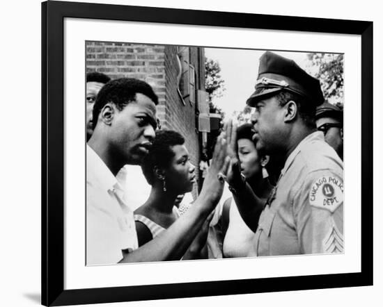 Chicago African American Policeman Tries to Calm a Crowd-null-Framed Photo