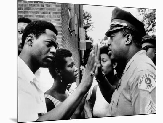 Chicago African American Policeman Tries to Calm a Crowd-null-Mounted Photo