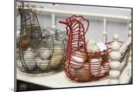 Chicken-shaped metal baskets holding rocks.-Julien McRoberts-Mounted Photographic Print