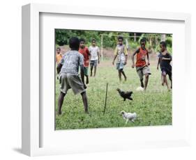 Chickens Run to Avoid a Soccer Game Played by Children from Lolovoli Village on the Island of Ambae-null-Framed Photographic Print