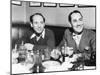 Chico (Left) and Groucho Marx at Lunch in the Famous Brown Derby Restaurant in Hollywood-null-Mounted Premium Photographic Print