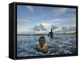 Child as She Plays in the Waves at a Beach in Port Blair, India-null-Framed Stretched Canvas