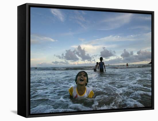 Child as She Plays in the Waves at a Beach in Port Blair, India-null-Framed Stretched Canvas