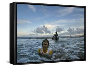 Child as She Plays in the Waves at a Beach in Port Blair, India-null-Framed Stretched Canvas