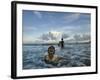 Child as She Plays in the Waves at a Beach in Port Blair, India-null-Framed Photographic Print