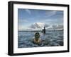 Child as She Plays in the Waves at a Beach in Port Blair, India-null-Framed Photographic Print