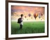 Child Carrying A Backpack Standing On A Green Meadow With Hot-Air Balloons In The Background-olly2-Framed Art Print