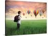 Child Carrying A Backpack Standing On A Green Meadow With Hot-Air Balloons In The Background-olly2-Stretched Canvas