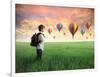 Child Carrying A Backpack Standing On A Green Meadow With Hot-Air Balloons In The Background-olly2-Framed Art Print