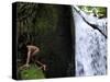 Child from the Ache Indigenous Group Plays Near a Waterfall in Cerro Moroti, Paraguay-null-Stretched Canvas
