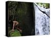 Child from the Ache Indigenous Group Plays Near a Waterfall in Cerro Moroti, Paraguay-null-Stretched Canvas