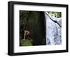 Child from the Ache Indigenous Group Plays Near a Waterfall in Cerro Moroti, Paraguay-null-Framed Photographic Print